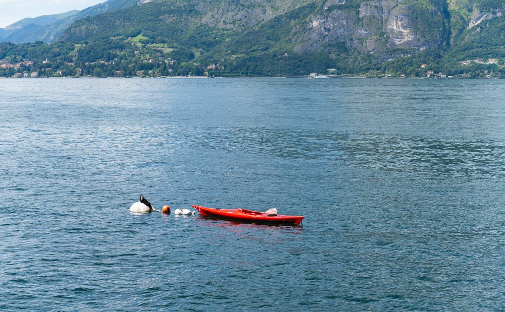 kayak anchored at lake como